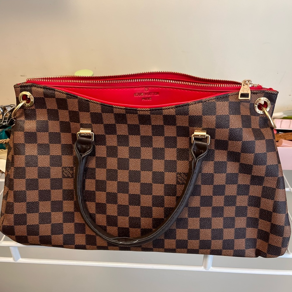 Women’s checkered brown leather handbag